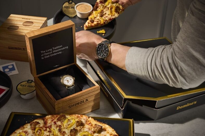 Domino's is offering customers exclusive access to a curated selection of black and gold Shinola timepieces and leather goods to celebrate the launch of its new Slice Sauce, which also comes in premium black and gold packaging.