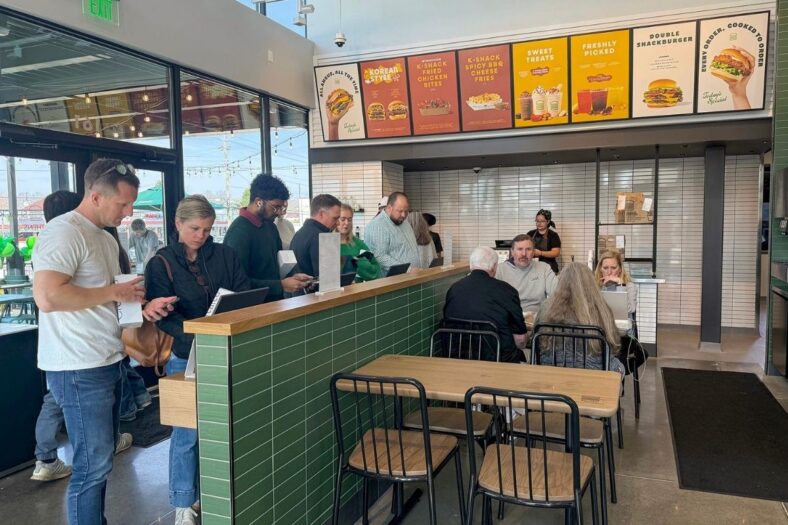 Guests place their orders at the kiosks on opening day of Shake Shack in Athens, Ga. on Wednesday, March 4, 2026.