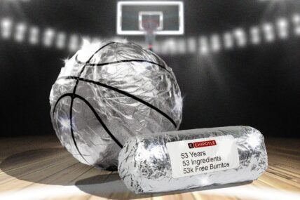 A basketball and burrito wrapped in foil.