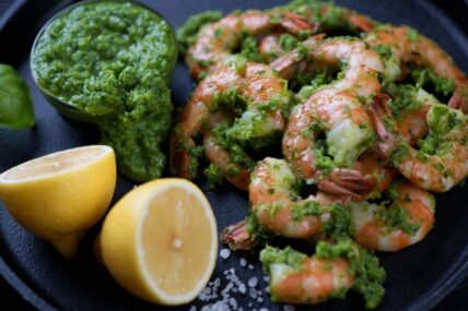 Tiger shrimps served with chimichurri sauce and lemon