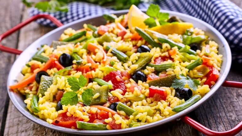 Colorful Vegetarian Paella Rice Dish Served in Pan