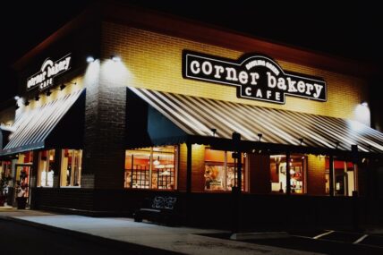 Corner Bakery Cafe exterior at night.